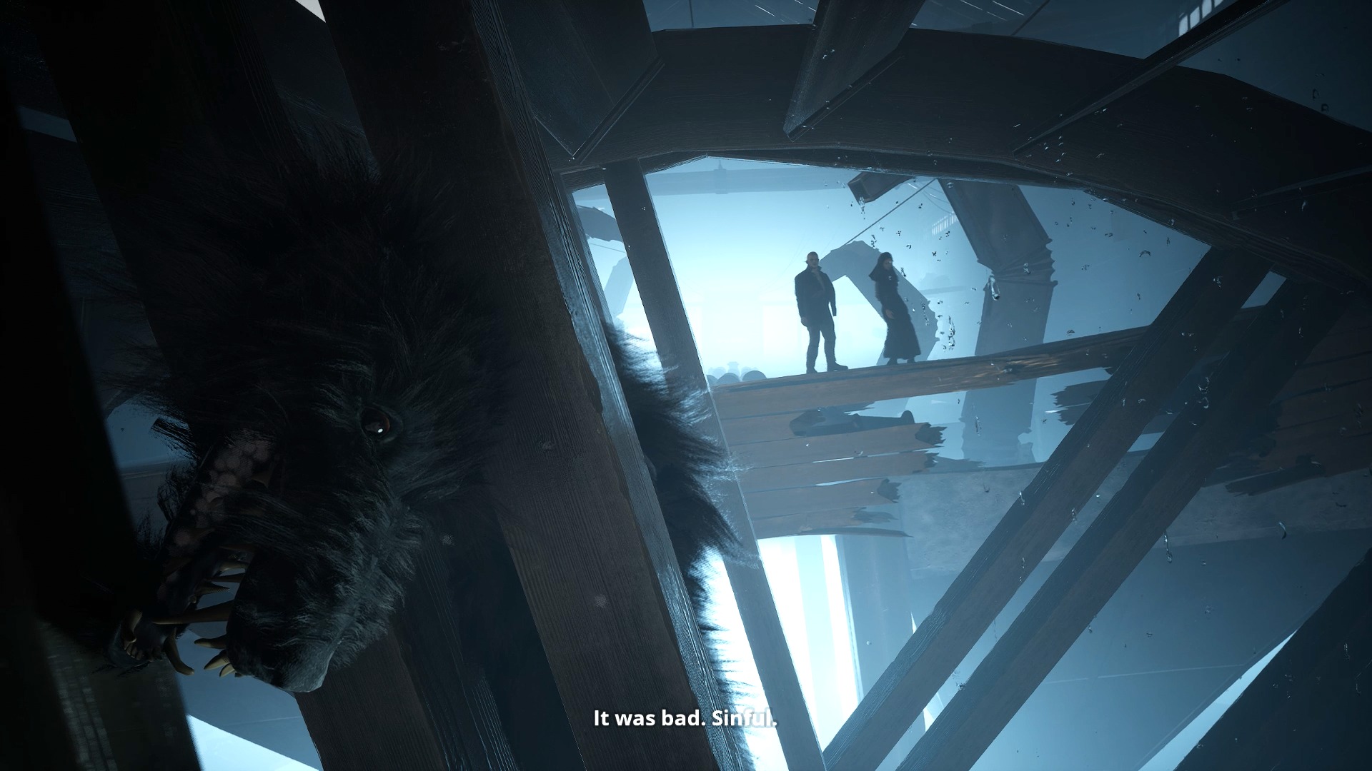 A dead dog hangs limply in a wooden while while two human figures, Ilya and Indika, stand silhouetted in the background.