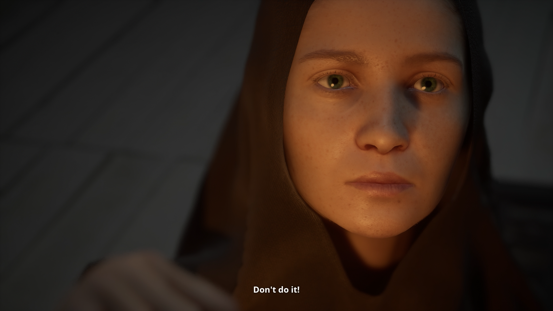 A close-up of Indika's face, the subtitles read: "Don't do it!"